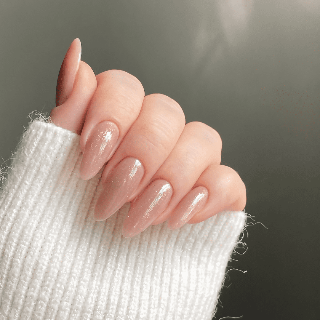 Long pink gel nails with a subtle sparkle finish at River Cottage Beauty Salon in Hamstreet – expert nail styling and glamorous results for nails in Kent.